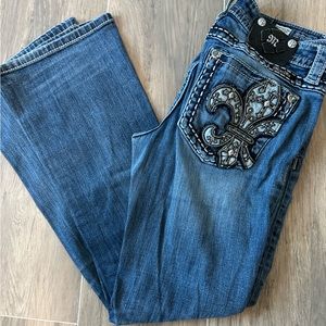 Boot cut, mid rise, miss me jeans